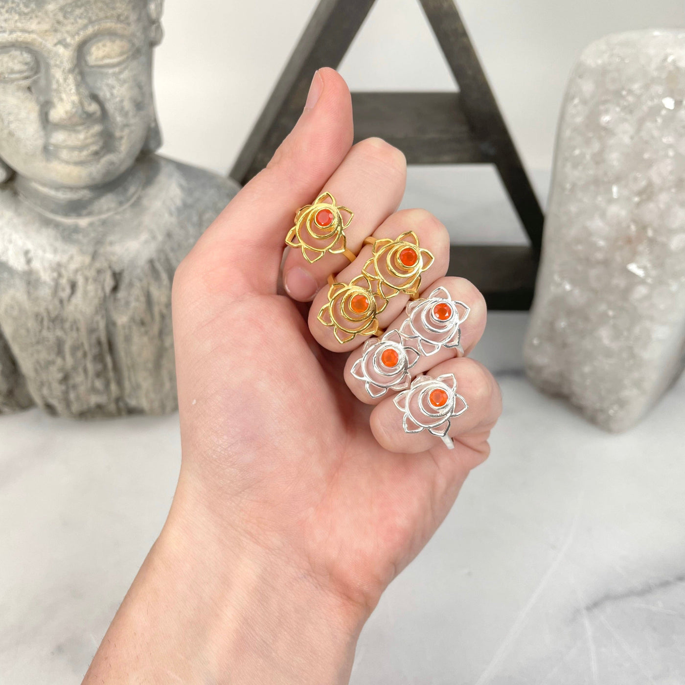 sacral chakra rings in hand for size reference