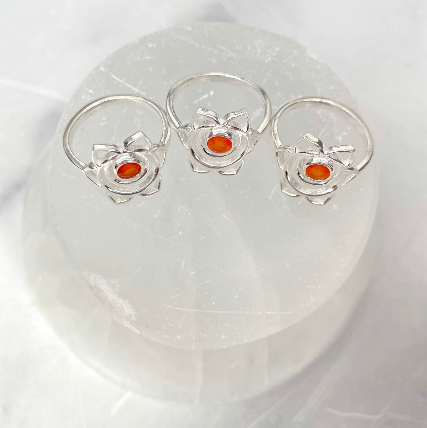 overhead view of silver sacral chakra rings