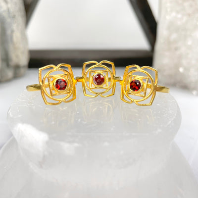 gold root chakra rings on display