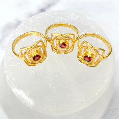 overhead view of gold root chakra rings