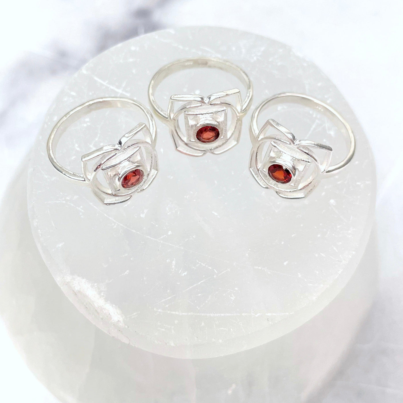overhead view of silver root chakra rings