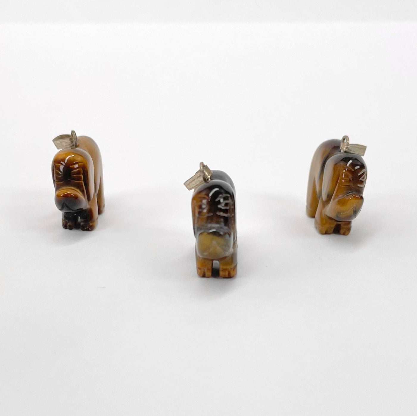 front view of tigers eye elephant pendants