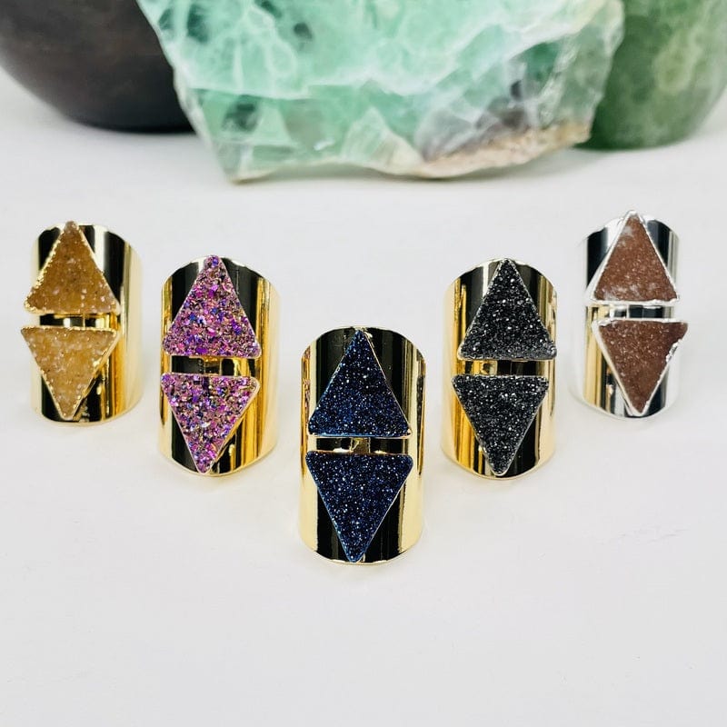 double triangle druzy cigar band rings displayed to show the differences in the drusy 