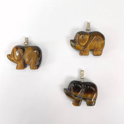 tigers eye elephant pendants laying flat
