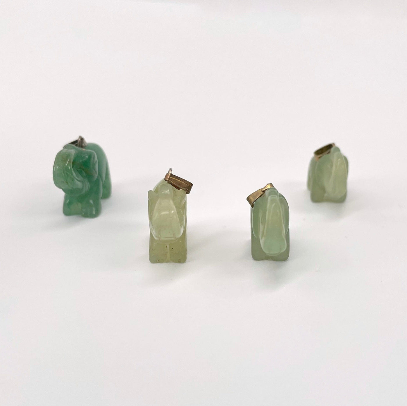 front view of green quartz elephant pendants