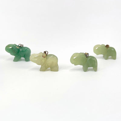 side view of green quartz elephant pendants
