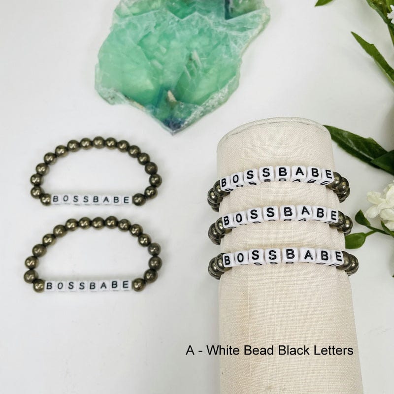 pyrite round bead bracelets with white square beads that spell out BOSSBABE in black