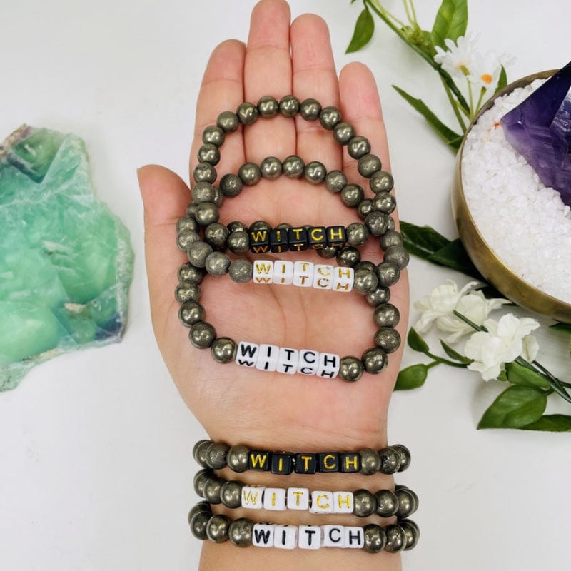 pyrite bead bracelets with black or white beads that spell out WITCH in black or gold
