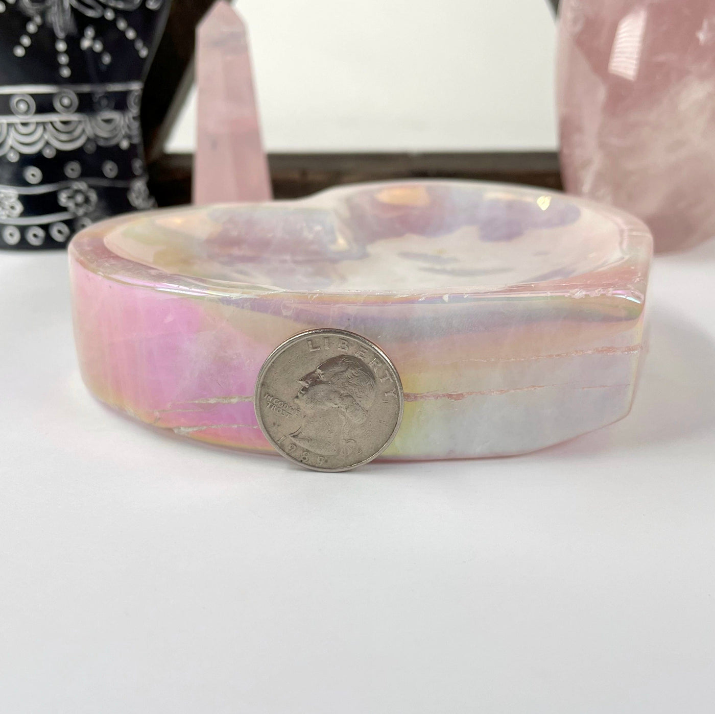 side view of angel aura rose quartz heart bowl with quarter for thickness