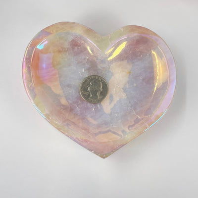 overhead view of angel aura rose quartz heart bowl with quarter for size reference
