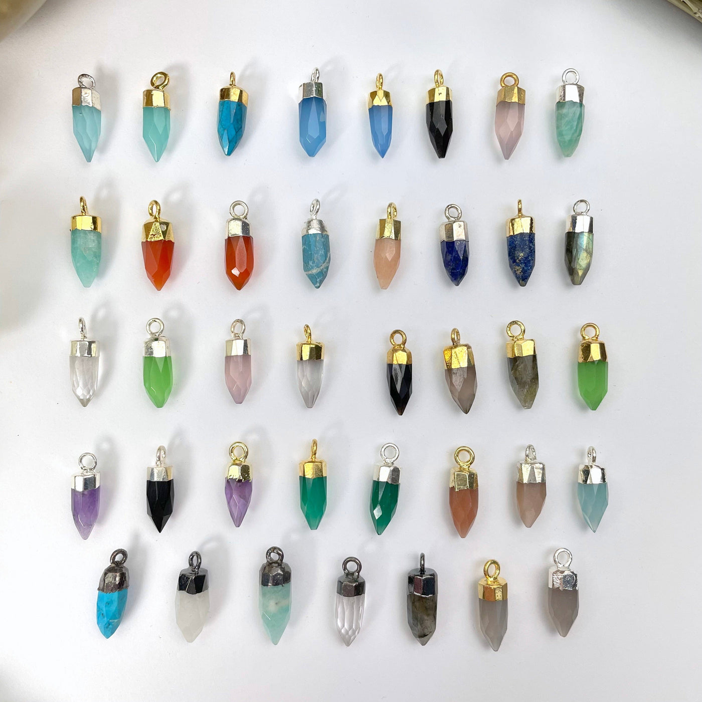 close up of all tiny spike pendant options on display