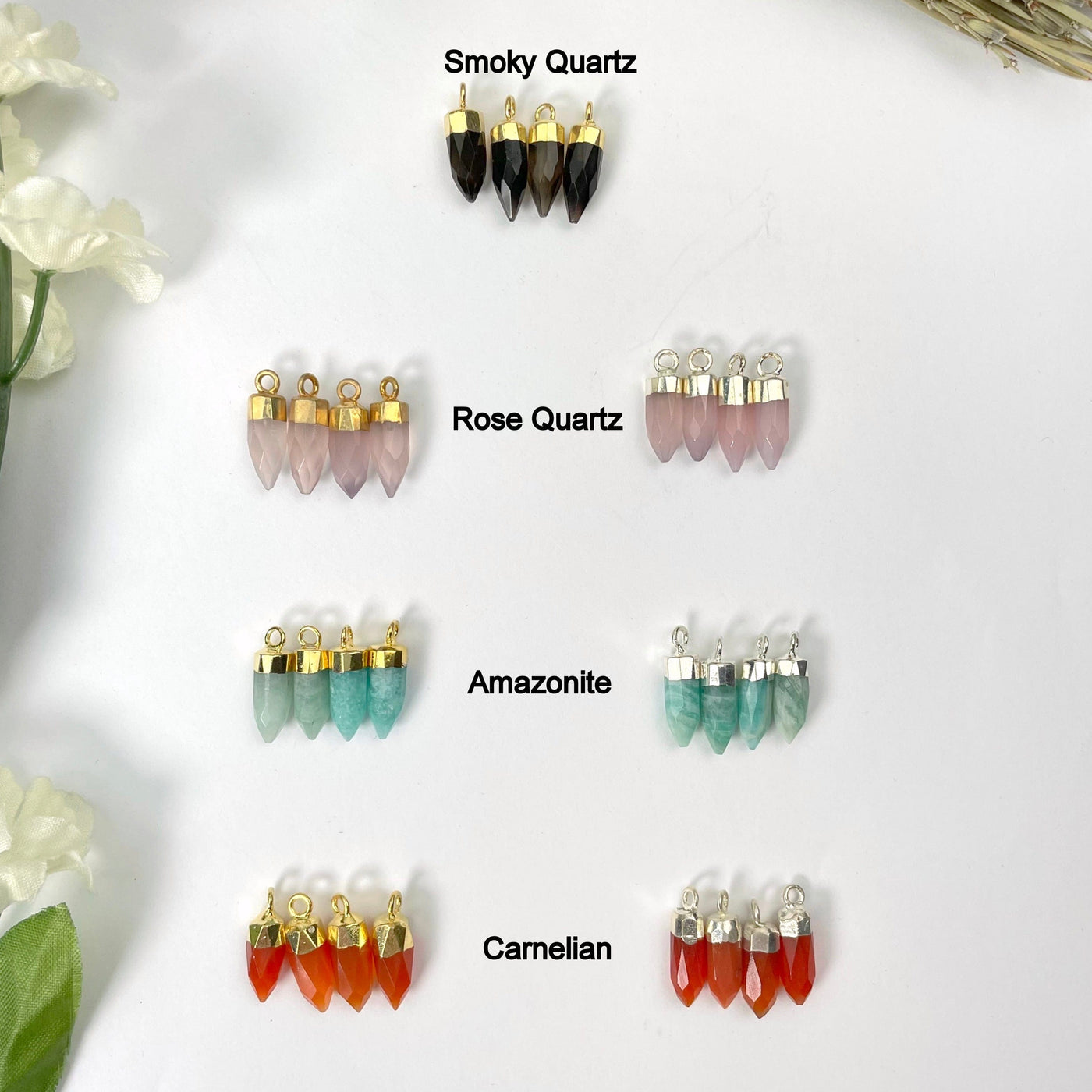 gold smoky quartz and gold and silver rose quartz, amazonite, and carnelian tiny spike pendant options on display