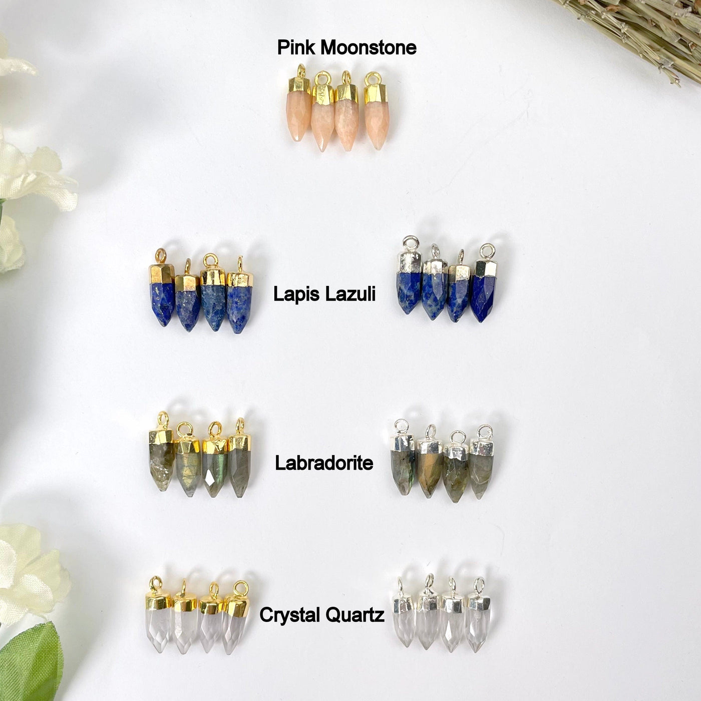 gold pink moonstone and gold and silver lapis lazuli, labradorite, and crystal quartz tiny spike pendant options on display