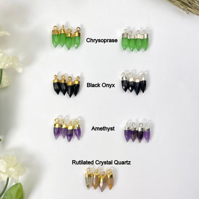 gold and silver chrysoprase, black onyx, amethyst, and gold rutilated crystal quartz tiny spike pendant options on display