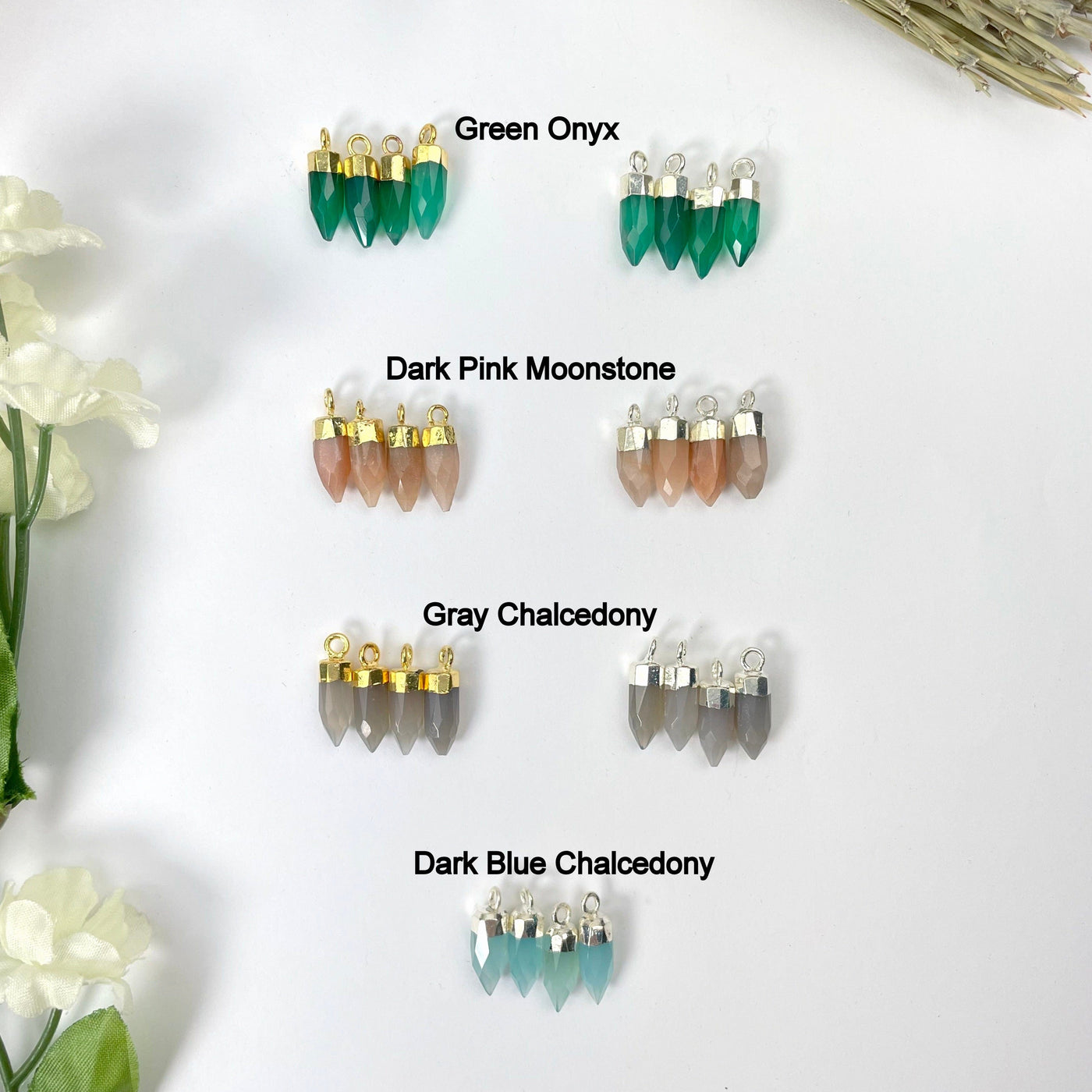 gold and silver green onyx, dark pink moonstone, gray chalcedony, and silver dark blue chalcedony tiny spike pendant options on display