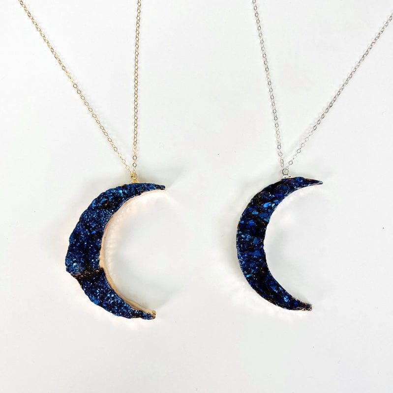 close up of the moon pendants displayed on a chain 