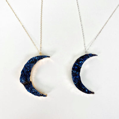 close up of the moon pendants displayed on a chain 