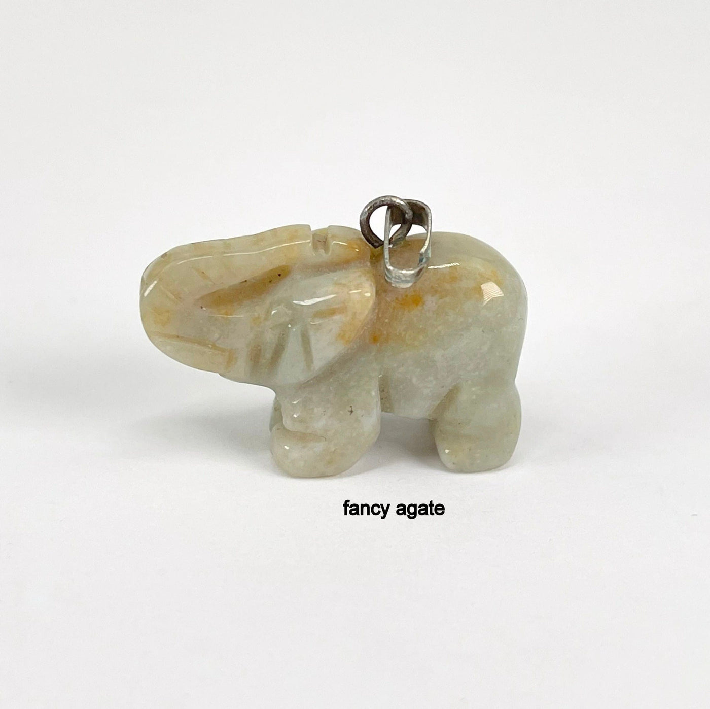 close up of fancy agate elephant pendant for details