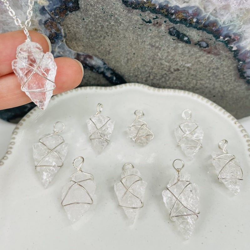 arrow head charms displayed to show the different wire wrapping designs possible