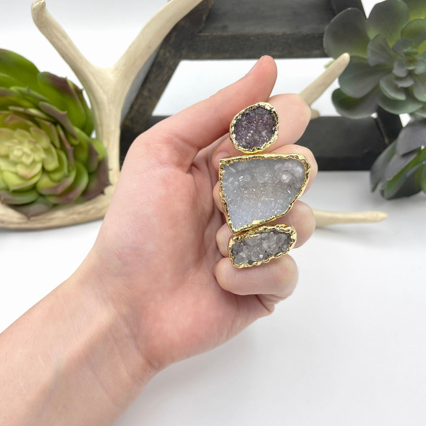 adjustable druzy ring on hand for size reference