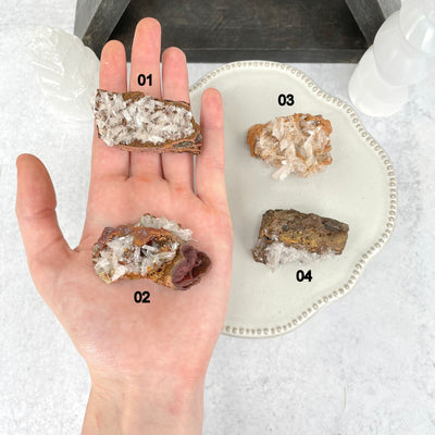 mexican hemimorphite clusters in hand and on display