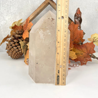 crystal quartz polished point with ruler for size reference