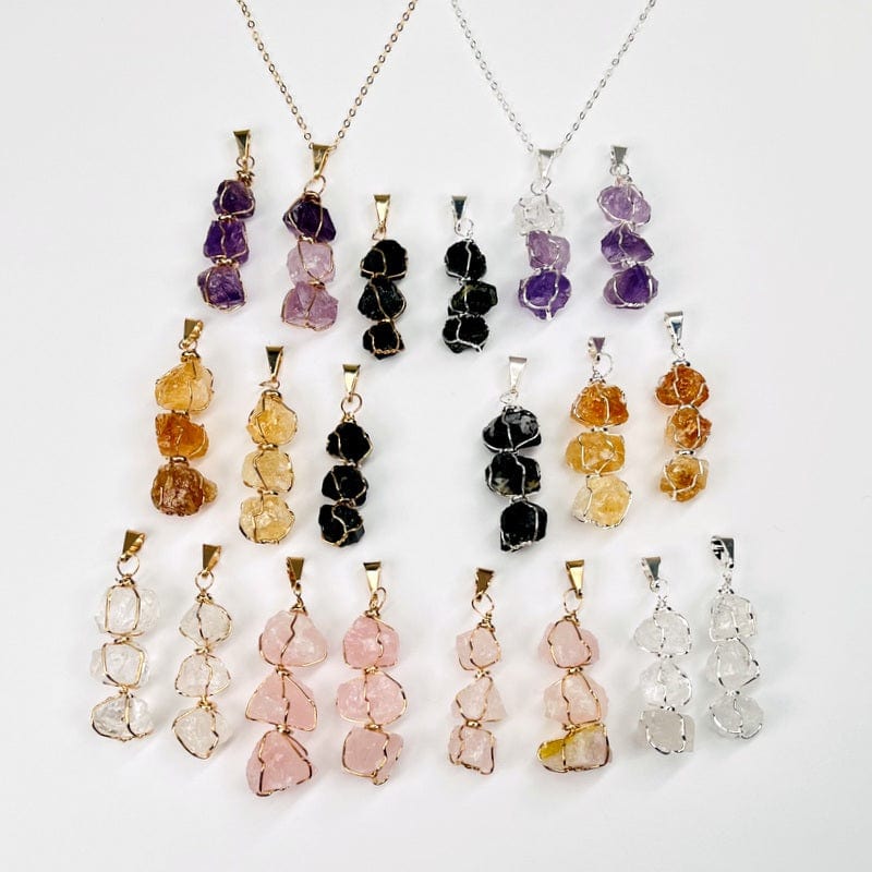 pendants displayed next to each other to show the differences in the stone types and colors 