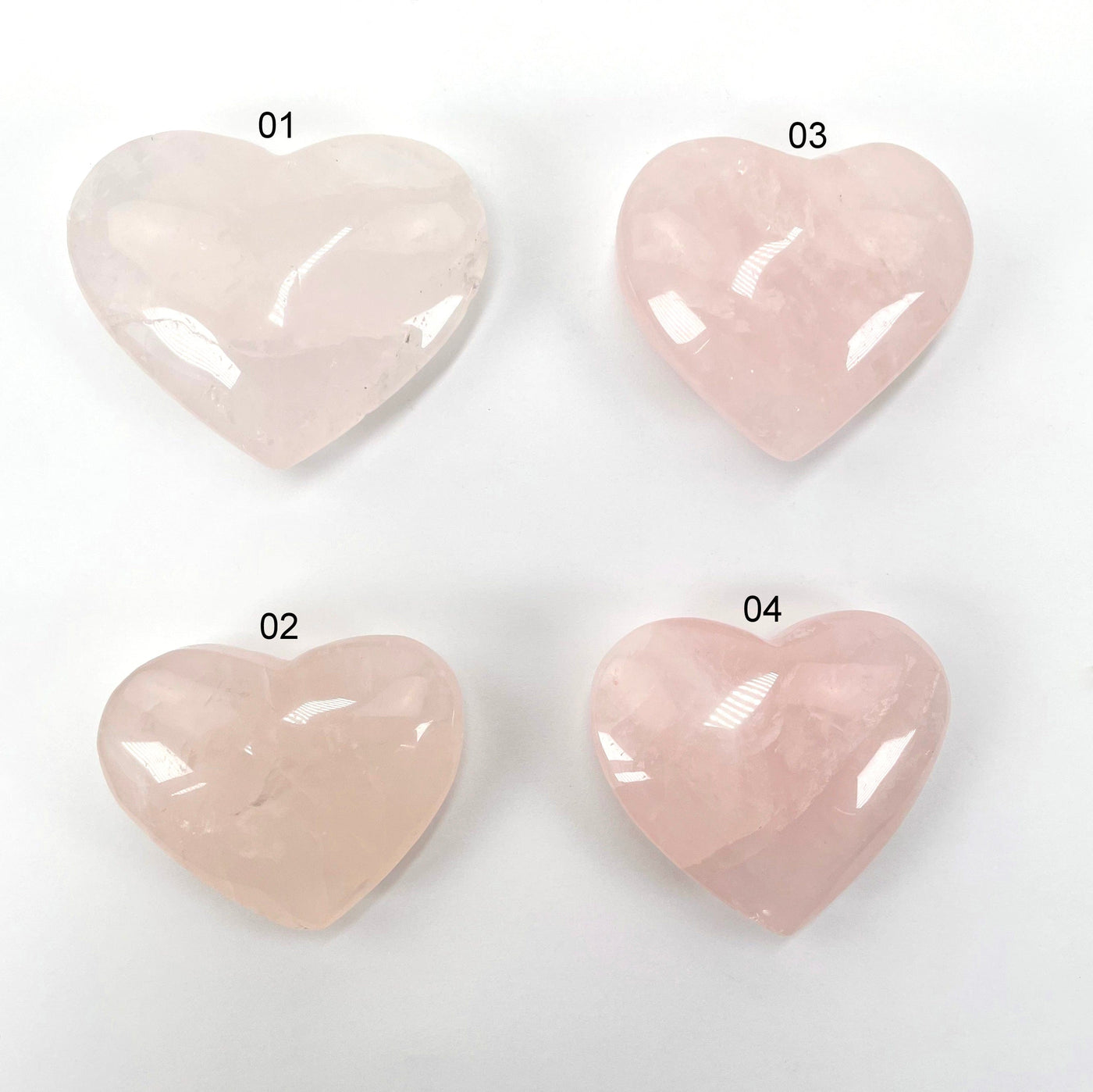 rose quartz polished hearts on display