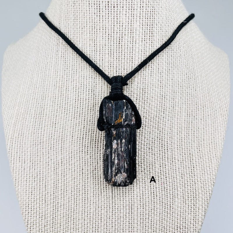 close up of the black tourmaline on a black cord necklace 