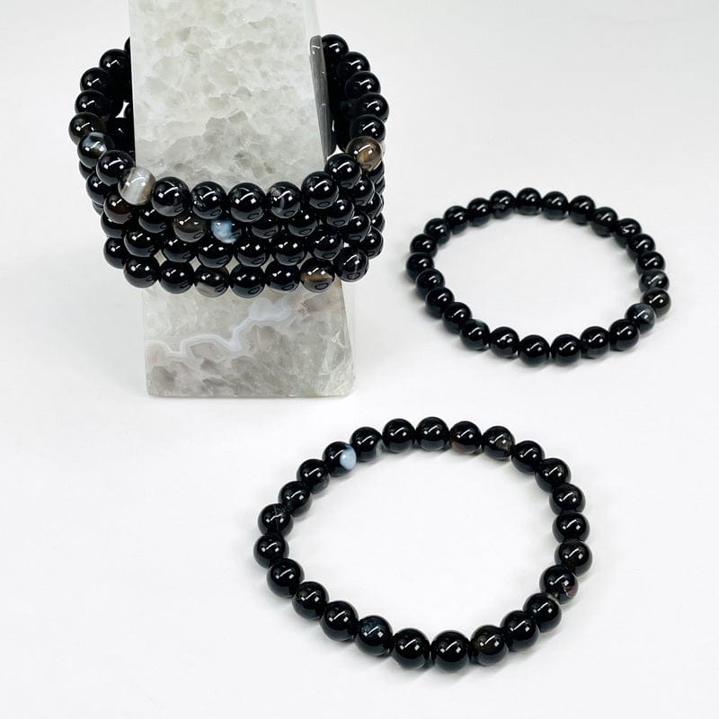 multiple bracelets displayed to show the differences in the black agate 