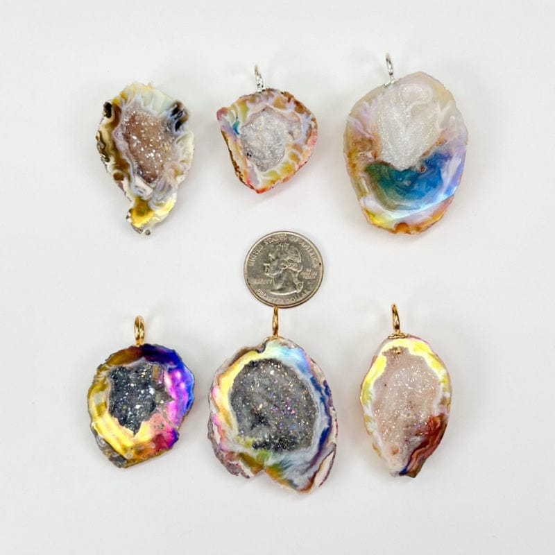 geode pendants next to a quarter for size reference 