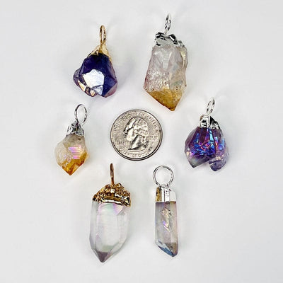 pendants next to a quarter for size reference 