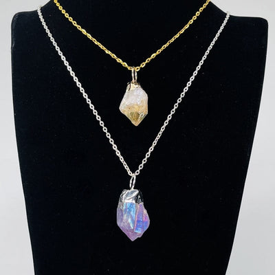 angel aura crystal point pendants displayed on a necklace chain 