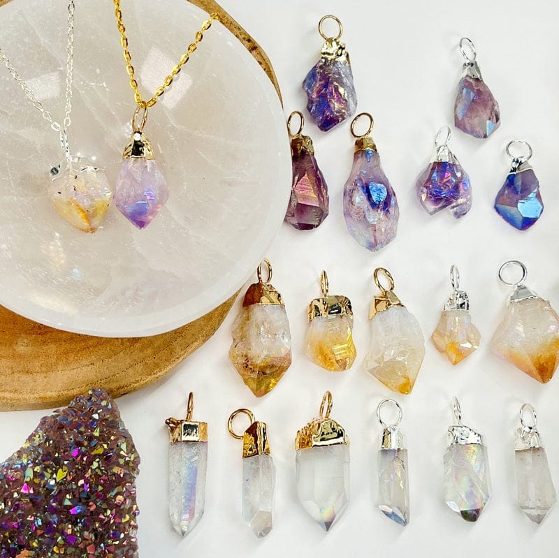 crystal pendants displayed next to each other to show the differences in the stone points and color shades 