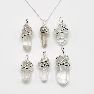 crystal quartz point pendants with thick silver wire wrapped cap and bail