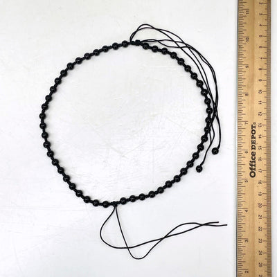 shortest necklace length with ruler for size reference