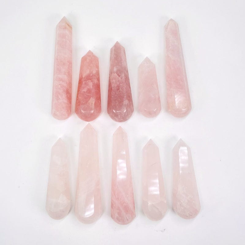 multiple rose quartz massage points displayed to show the differences in the sizes and color shades 