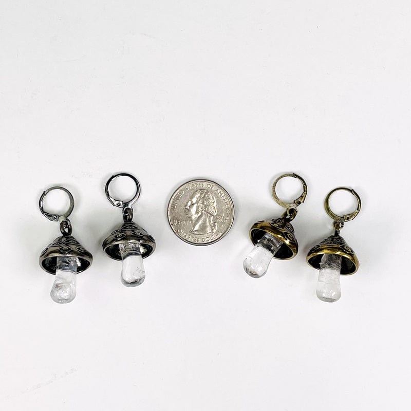 earrings displayed next to a quarter for size reference 