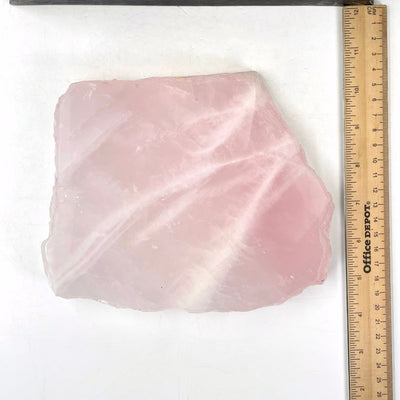 overhead view of rose quartz platter with ruler for size reference 