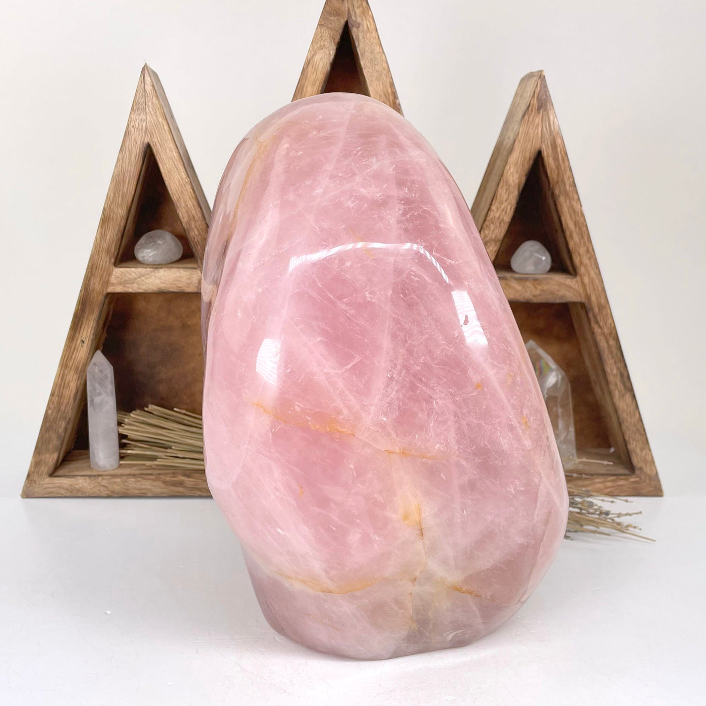 side view of rose quartz polished cut base for thickness