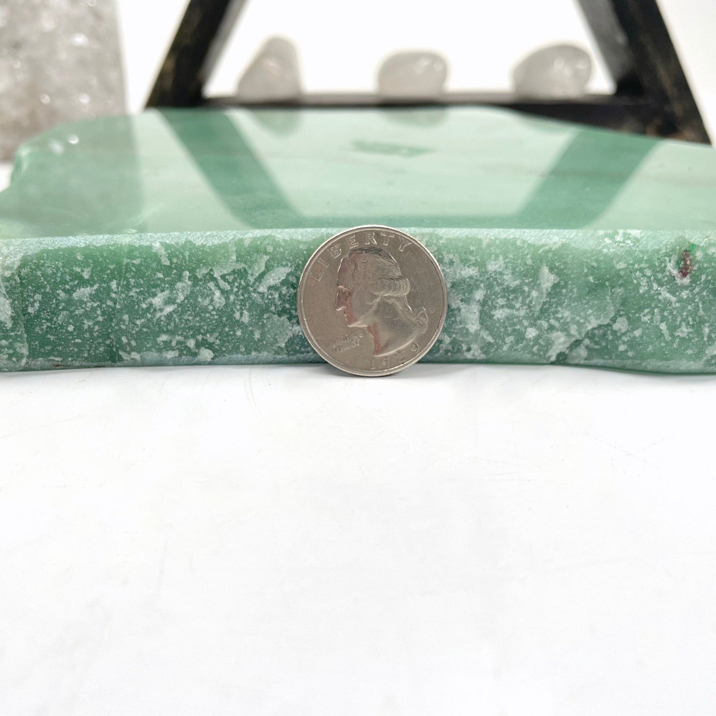 side view of green quartz platter with quarter for thickness