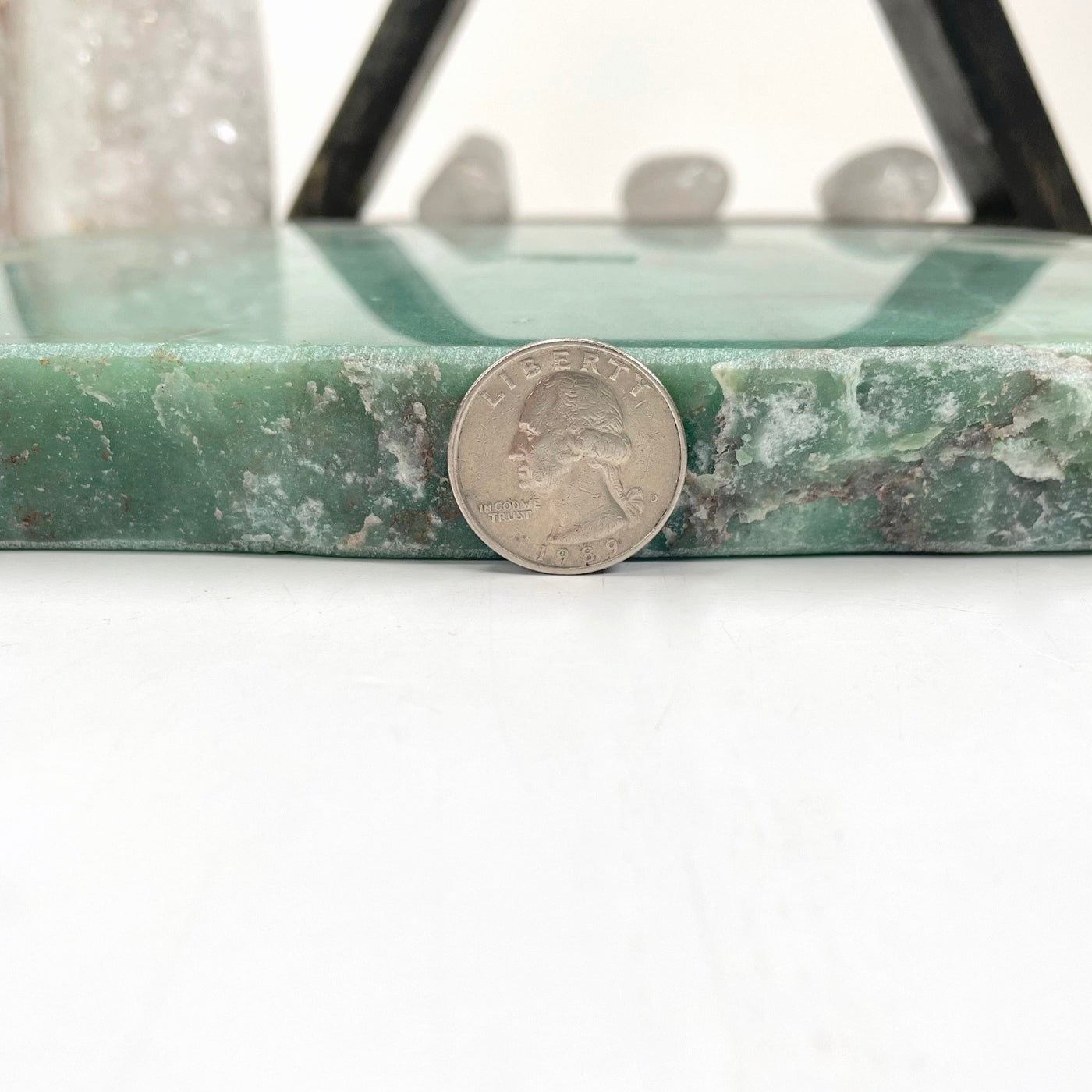 side view of green quartz platter with quarter for thickness