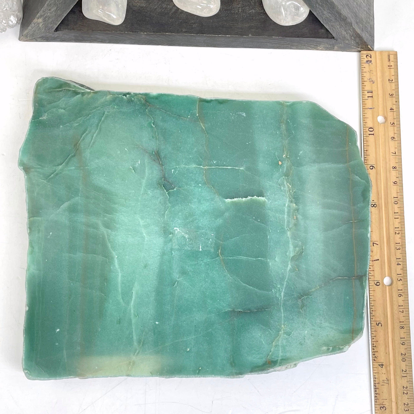 overhead view of green quartz platter with ruler for size reference