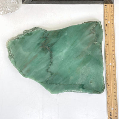 overhead view of green quartz platter with ruler for size reference