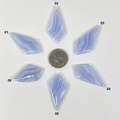 all blue lace agate polished diamond pendants with quarter for size reference