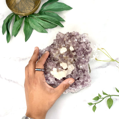 Hand comparing size to the Amethyst Cluster Calcite 