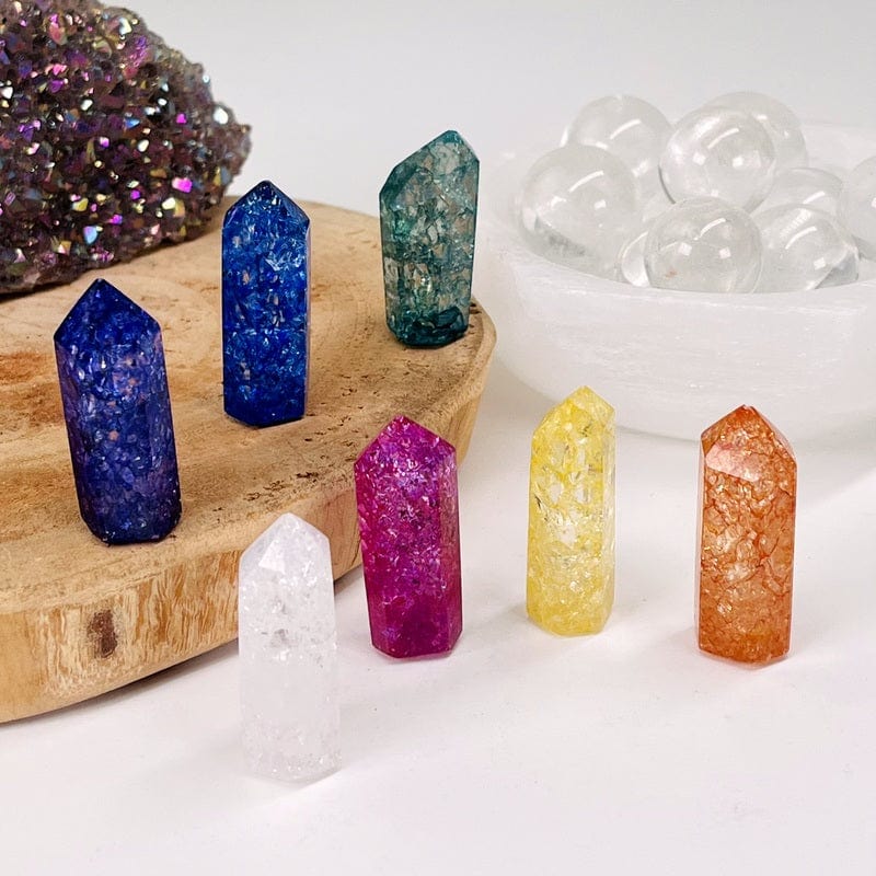 crackled quartz pencil points displayed to show the differences in the sizes and colors available 
