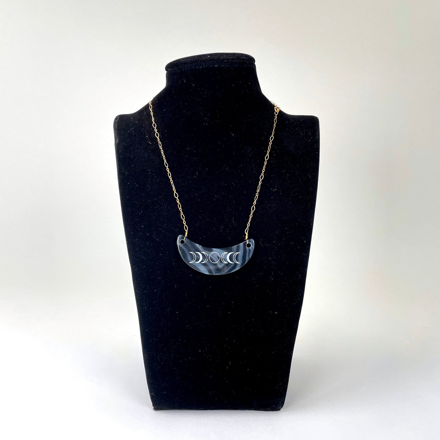 shortened dark blue agate crescent pendant necklace with moon phase on bust display