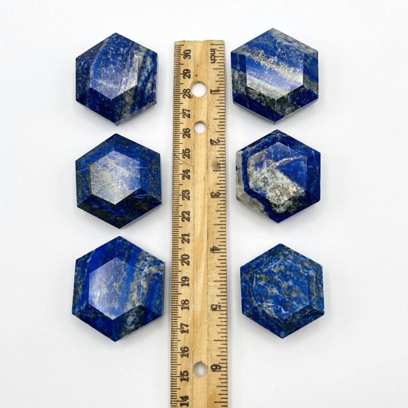 hexagons next to a ruler for size reference 