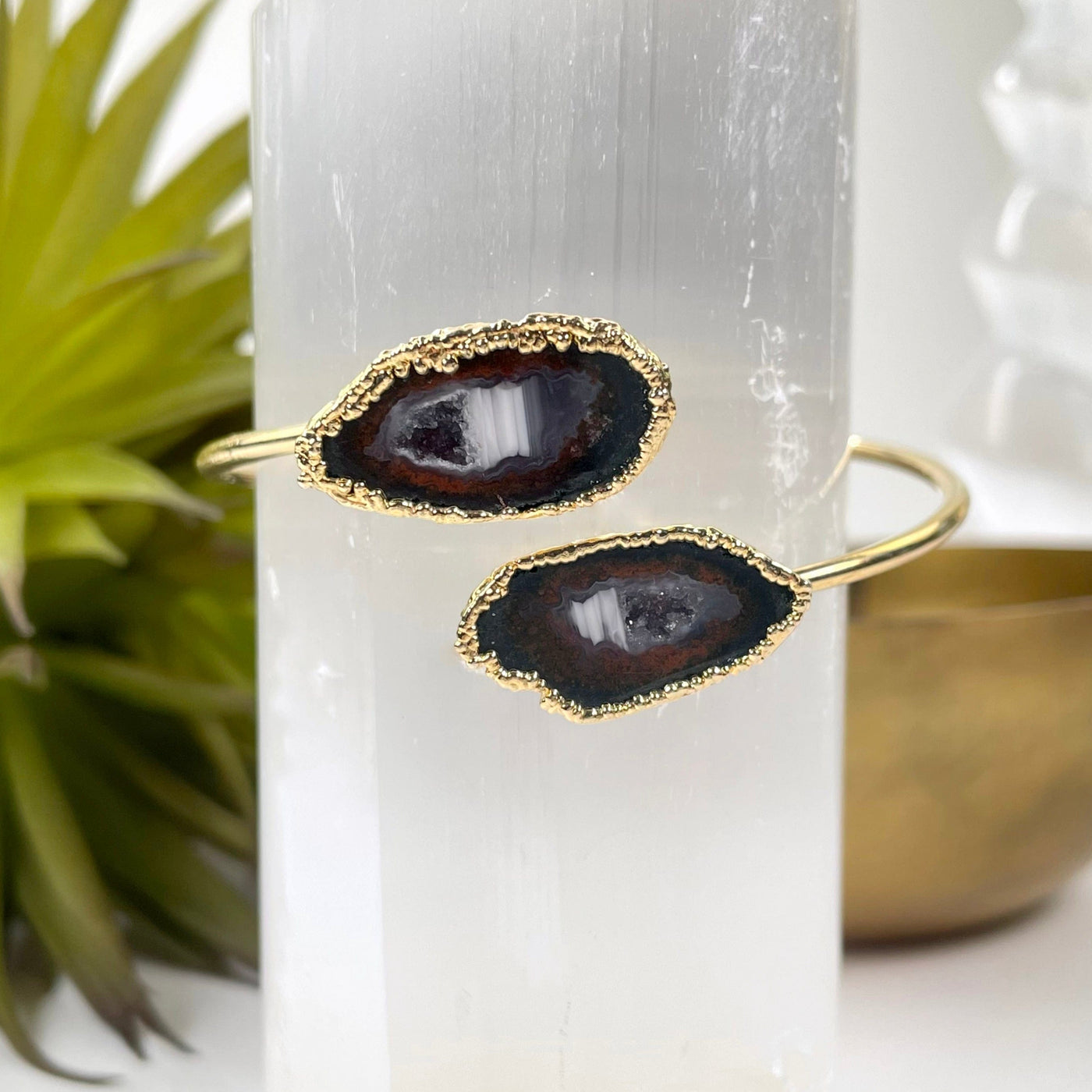 geode pair bracelet with electroplated gold edge on display